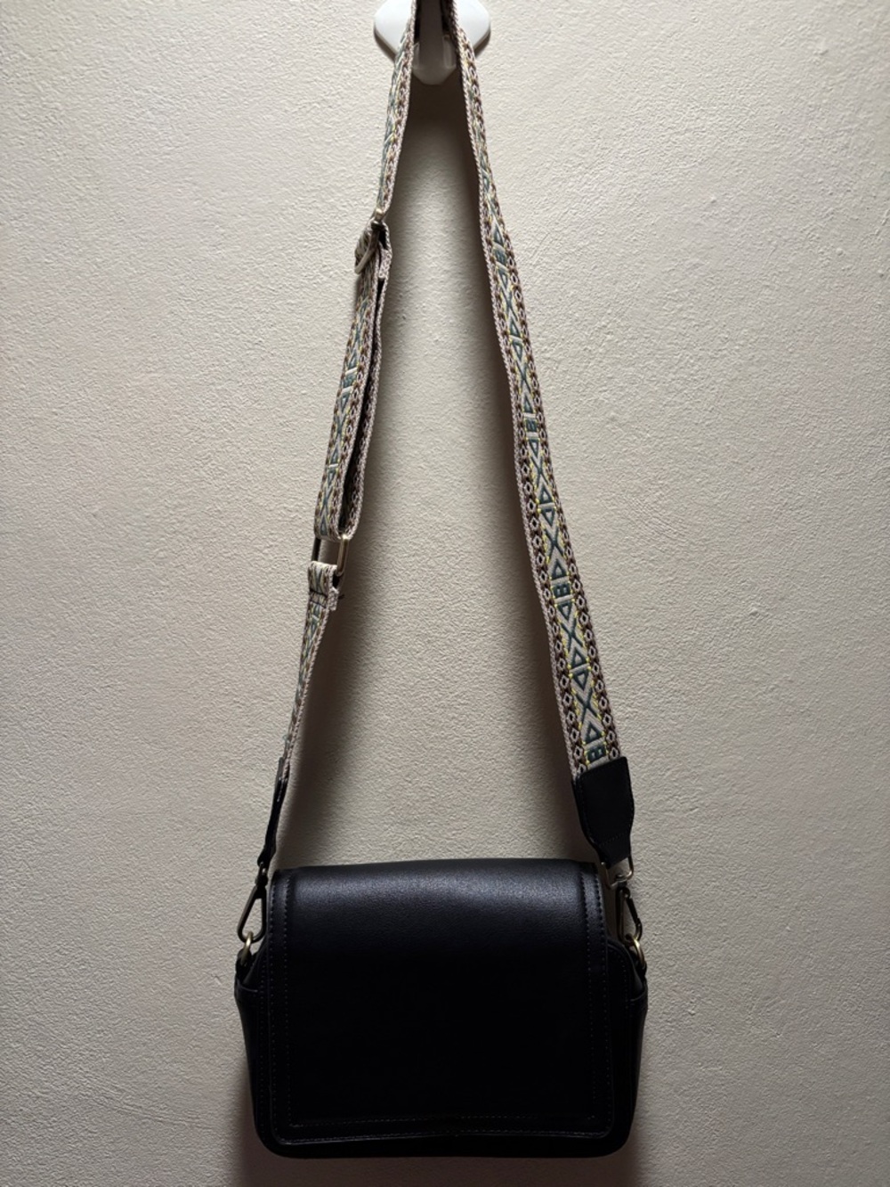 Classic Black Crossbody Bag with Patterned Strap